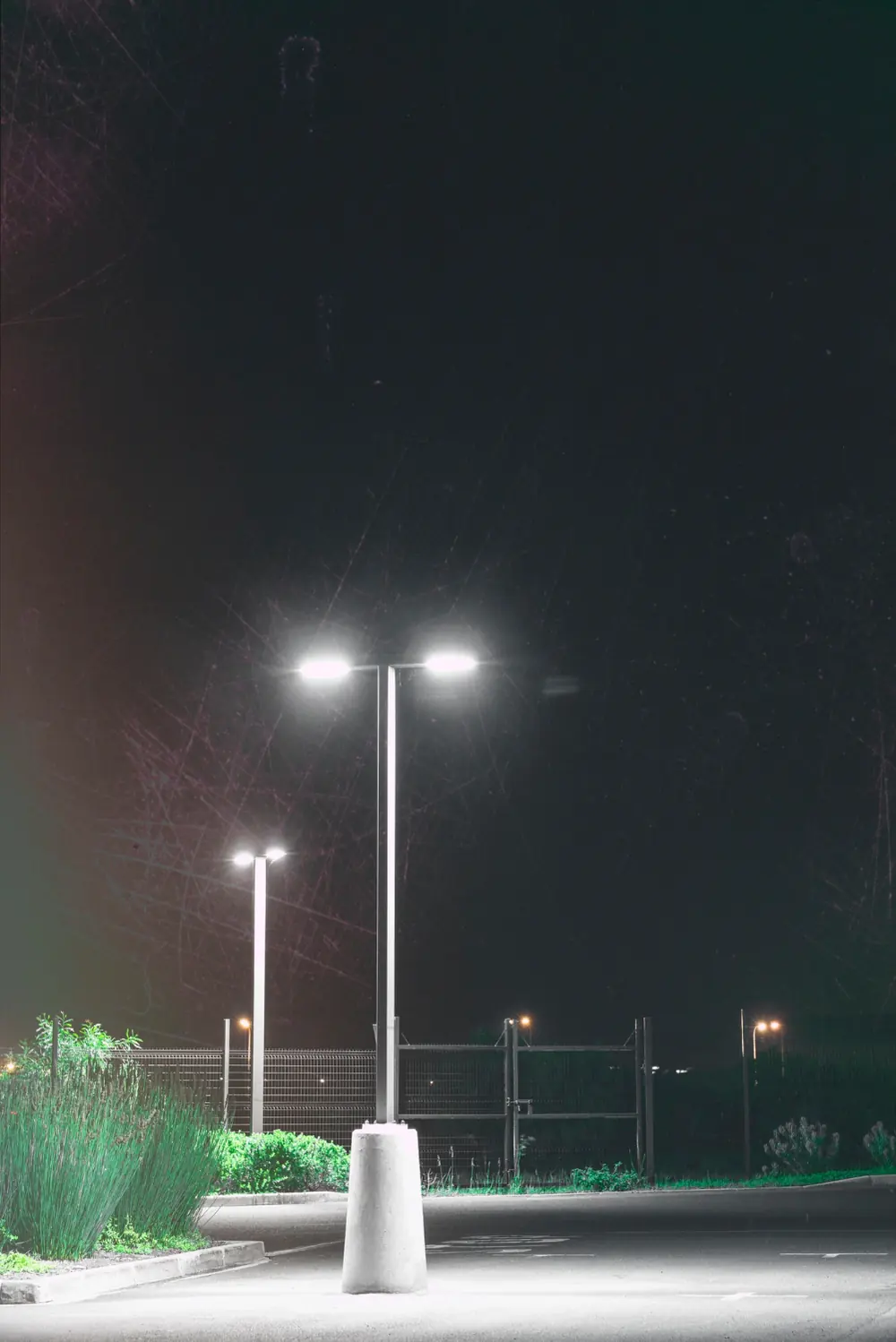 Solar street lights lit at night along a path